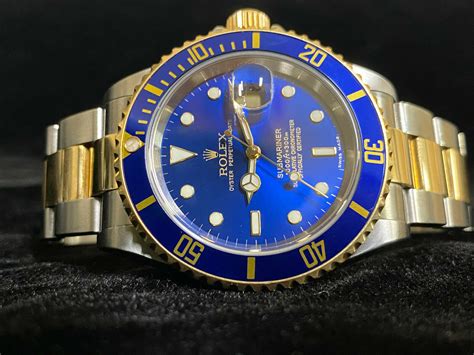 rolex submariner gold steel blue|Rolex Submariner watches goldsmiths.